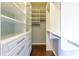 Bright walk-in closet featuring custom shelving, drawers, and ample storage space at 1365 Hawthorne Se Ave, Smyrna, GA 30080
