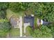 Aerial shot showcasing the property's location, roof, surrounding greenery, and driveway at 3543 Pine Grove Dr, Douglasville, GA 30135