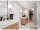 Spacious bathroom featuring double vanities, walk in shower, and access to a walk-in closet at 3543 Pine Grove Dr, Douglasville, GA 30135