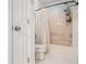 Cozy bathroom with tub and shower, toilet, and patterned floor at 3543 Pine Grove Dr, Douglasville, GA 30135