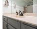 Close-up of bathroom vanity with gray cabinets and a white countertop at 3543 Pine Grove Dr, Douglasville, GA 30135