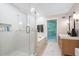 Bright bathroom features a glass enclosed shower, soaking tub, and vanity with granite countertops at 3543 Pine Grove Dr, Douglasville, GA 30135