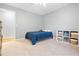 Bright bedroom features neutral walls, carpet floors and a single bed at 3543 Pine Grove Dr, Douglasville, GA 30135