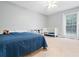 Comfortable bedroom with crib, bed, and window with natural light providing a tranquil space at 3543 Pine Grove Dr, Douglasville, GA 30135