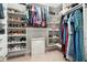 Walk in closet with organized shelves, plenty of room for clothes and shoes, and carpeting at 3543 Pine Grove Dr, Douglasville, GA 30135