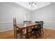 Traditional dining room features hardwood floors, a stylish chandelier, and classic trim work at 3543 Pine Grove Dr, Douglasville, GA 30135