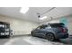 Car parked in garage with painted floor, storage and automatic door at 3543 Pine Grove Dr, Douglasville, GA 30135