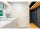 Practical laundry room with washer, dryer, and ample storage; a great space for chores at 3543 Pine Grove Dr, Douglasville, GA 30135