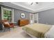 Main bedroom with large windows, tray ceilings, neutral colors, and a full view of bedroom set at 3543 Pine Grove Dr, Douglasville, GA 30135
