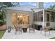 Relaxing patio area with outdoor seating, offering a tranquil space for enjoying the backyard and screened porch at 3543 Pine Grove Dr, Douglasville, GA 30135