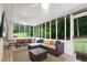 Relaxing screened-in porch with comfortable seating, perfect for enjoying the outdoors at 3543 Pine Grove Dr, Douglasville, GA 30135