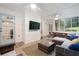 Entertain on the screened-in porch with outdoor seating, a ceiling fan, and access to the yard at 3543 Pine Grove Dr, Douglasville, GA 30135