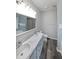 Full bathroom features a double sink vanity with hard surface countertops and tile flooring at 36 Laurel Ne Way, White, GA 30184