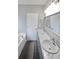 Elegant bathroom featuring double sinks with marble countertops, modern fixtures, and a separate bathtub at 36 Laurel Ne Way, White, GA 30184