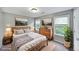 Bedroom features hardwood floors, neutral paint, and bright, natural light at 36 Laurel Ne Way, White, GA 30184