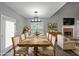 Spacious dining area adjacent to the living room, featuring a large wooden table and stylish lighting at 36 Laurel Ne Way, White, GA 30184