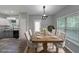 Dining area with modern light fixtures, table with seating for six and bright, natural light at 36 Laurel Ne Way, White, GA 30184