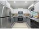 Well-appointed kitchen boasts stainless steel appliances, modern countertops, and ample cabinet space for storage at 36 Laurel Ne Way, White, GA 30184
