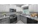 Charming kitchen with granite countertops, stainless steel appliances, and custom cabinets at 36 Laurel Ne Way, White, GA 30184