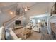 Open-concept living area with fireplace and staircase, seamlessly connects to the dining area, offering a spacious and inviting atmosphere at 36 Laurel Ne Way, White, GA 30184