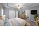 Relaxing main bedroom with tray ceiling, ensuite bathroom, neutral color scheme, and plenty of natural light at 36 Laurel Ne Way, White, GA 30184