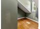 Cozy attic space features hardwood floors, a window, and a neutral color scheme at 385 Russell Ridge Dr, Lawrenceville, GA 30043
