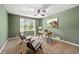 Comfortable bedroom features soft carpet, neutral color walls, and a classic ceiling fan at 385 Russell Ridge Dr, Lawrenceville, GA 30043