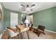Comfortable bedroom features soft carpet, neutral color walls, and a classic ceiling fan at 385 Russell Ridge Dr, Lawrenceville, GA 30043