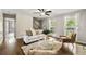 Comfortable living room with hardwood floors, shiplap accent walls, and a bright, airy atmosphere at 385 Russell Ridge Dr, Lawrenceville, GA 30043