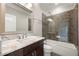 Stylish bathroom showcases walk-in shower, marble countertop, and modern fixtures creating a spa-like ambiance at 4015 Roberts Crest Ln, Suwanee, GA 30024