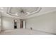 Primary bedroom with decorative ceiling and access to a full bathroom at 4015 Roberts Crest Ln, Suwanee, GA 30024