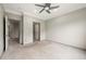 Neutral bedroom features soft carpeting, gray walls, and views to other rooms in the home at 4015 Roberts Crest Ln, Suwanee, GA 30024