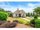 Community clubhouse surrounded by green spaces, mature landscaping, and a playground at 4015 Roberts Crest Ln, Suwanee, GA 30024