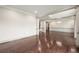 Large living room with hardwood floors, decorative ceilings and view of stairway at 4015 Roberts Crest Ln, Suwanee, GA 30024