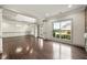 Large living room with hardwood floors and decorative ceilings at 4015 Roberts Crest Ln, Suwanee, GA 30024