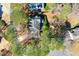 Stunning aerial shot of the home with a view of the surrounding tree-lined neighborhood at 4506 Westcliff Ne Trce, Roswell, GA 30075