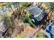 Aerial view of the residence showing manicured landscaping, mature trees, and rooftop details at 4506 Westcliff Ne Trce, Roswell, GA 30075