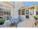 Outdoor patio featuring blue Adirondack chairs and a screened-in porch at 4506 Westcliff Ne Trce, Roswell, GA 30075