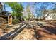 Picturesque backyard showing a lush green lawn and scenic landscaping for idyllic outdoor living at 4506 Westcliff Ne Trce, Roswell, GA 30075