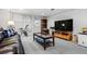Comfortable finished basement with a leather sofa, a large TV and neutral carpet at 4506 Westcliff Ne Trce, Roswell, GA 30075