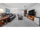 Cozy finished basement with a leather sofa, large TV, and walk-out door at 4506 Westcliff Ne Trce, Roswell, GA 30075