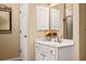 A classic bathroom features a white vanity, an elegant mirror and a nearby shower at 4506 Westcliff Ne Trce, Roswell, GA 30075