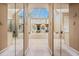 A bright bathroom featuring a large bathtub, natural light, and mirrored walls at 4506 Westcliff Ne Trce, Roswell, GA 30075