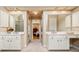 A spacious bathroom featuring double vanity sinks and mirrored walls at 4506 Westcliff Ne Trce, Roswell, GA 30075