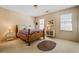 A cozy bedroom featuring carpet and a bed with a quilt at 4506 Westcliff Ne Trce, Roswell, GA 30075