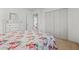 A well-lit bedroom is furnished with a floral-patterned bed and white dresser at 4506 Westcliff Ne Trce, Roswell, GA 30075