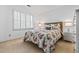 A bright bedroom features a floral-patterned comforter and shuttered windows at 4506 Westcliff Ne Trce, Roswell, GA 30075