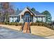 Elegant clubhouse with classic design, well-maintained landscaping, and inviting entryway at 4506 Westcliff Ne Trce, Roswell, GA 30075