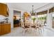 Charming dining area with a large window, oak cabinets and tiled floors at 4506 Westcliff Ne Trce, Roswell, GA 30075