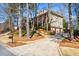 Suburban home with a long driveway and a well-manicured lawn and landscaping at 4506 Westcliff Ne Trce, Roswell, GA 30075